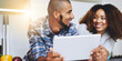 © Delmaine D/peopleimages.com - Are you thinking what Im thinking. Shot of a young couple using a tablet together at home.