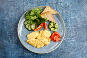 Wall Mural - omelet with fresh vegetables and salmon