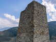 © Eduard Belkin - An ancient tower built of stones in the mountains to protect against attack. Ancient masonry. An ancient building high in the mountains.