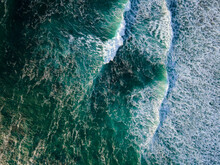 Bird's Eye View Of Teal Ocean Waves Nearing The Shore