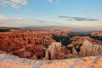 Poster - High angle of the Bryce Canyon, Utah partly covered with green forests at sunset