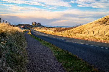 Canvas Print - Northumberland 250 leading to Bamburgh, as part of the coastal section on the Northumberland 250, a scenic road trip though Northumberland with many places of interest along the route