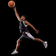 Taking his game up a level. Studio shot of a basketball player against a black background.