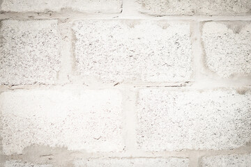 Abstract real photo grunge background. Light Grey concrete white light grey brick wall macro close up texture surface shot. Design, decorative trim. Blurred view