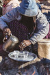 Bedouin woman cooking tea on the fire in Bedouin village, Egypt