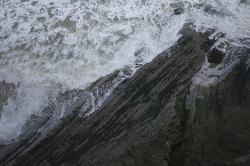 Sticker - Wave breaking against the cliffs