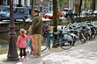 © MNStudio - Young father and his two kids having a good time in Amsterdam, Netherlands.