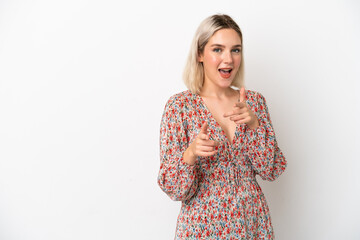 Young caucasian woman isolated on white background pointing to the front and smiling