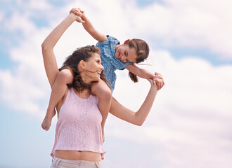 Poster - Spending quality time with mom. A little girl and her mother at the beach.