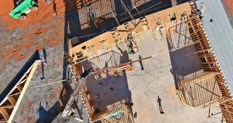 Wall Mural - Roofer working with framing installing the roof truss wood