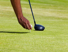 This Is Going Tobe Carry. Cropped Shot Of A Golfer Placing A Ball On A Tee.