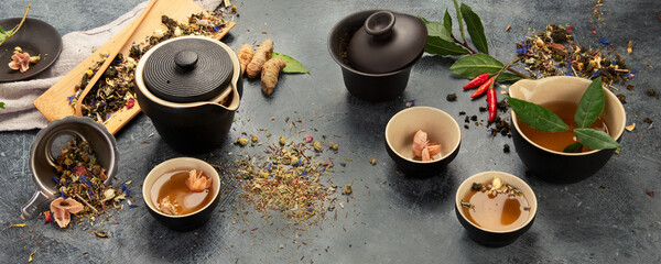 Wall Mural - Asian tea set on dark background.