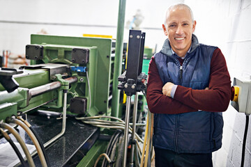 Poster - Everything is in perfect condition. Portrait of a mature man standing next to machinery in a factory.