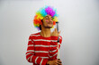© FireFXStudio - Young boy with pichkari and paying holi isolated BG