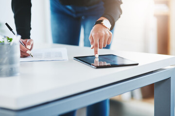 Poster - Tapping in to new markets. Closeup shot of a businesswoman working on a digital tablet in an office.
