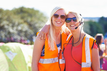 Making Sure There Are No Problems. Portrait Of Two Young Female Event Staff Members At A Festival.