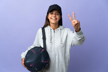 Wall Mural - Young sport woman with sport bag smiling and showing victory sign