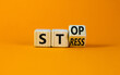 Stop stress and be health symbol. Turned the wooden cube and changed the concept words Stress to Stop. Beautiful orange background. Psychological business and stop stress concept. Copy space.