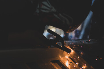 welder, welding automotive part in a car factory