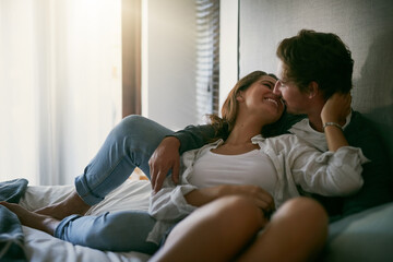 Sticker - Nothing beats coming home to loving arms. Cropped shot of a loving young couple spending the day together at home.