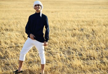 Wall Mural - Arabic young man in nature