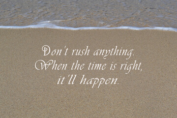 Wall Mural - Motivational and inspirational quote on sandy beach background.