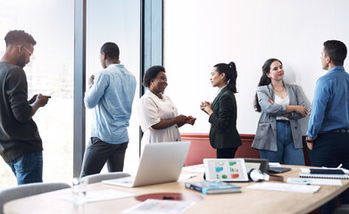 Poster - Success in the making. Shot of a group of businesspeople working in an office.