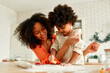 © Valerii Apetroaiei - African american family at home