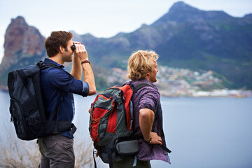 Canvas Print - The view is unbelievable. Two male backpackers admiring a great view.