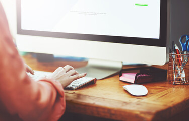 Poster - Staying on top of things. Closeup shot of an unrecognizable businesswoman working on a computer in an office.