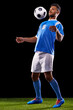 © Duncan M/peopleimages.com - His chest control is perfect. Full length studio shot of a handsome young soccer player isolated on black.