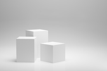 Blank white podium platforms or pedestals with white background for product display.