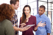 © T Hover/peopleimages.com - Technology and teamwork are all the resources they need. Cropped shot of a team of designers working together on a digital tablet in an office.