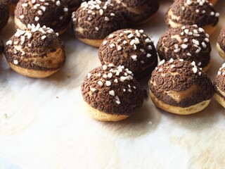 Canvas Print - Choux pastry with chocolate cracked cookie crumble crust and sugar nib