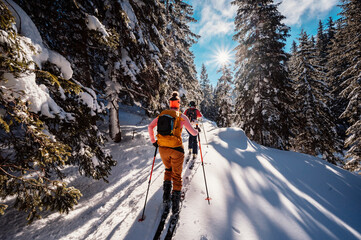 mountaineer backcountry ski walking ski alpinist in the mountains. ski touring in alpine landscape w