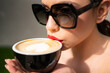 © Volodymyr - Closeup beautiful girl with coffee. Beauty romantic woman with cup of coffee. Close up woman lip with mouth drink latte.