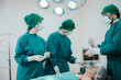 © chokniti - professional surgeon doctor teamwork person working in hospital operation room with surgery medical health equipment with surgical patient and nurse, emergency medicine treatment clinic concept