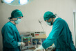 © chokniti - professional surgeon doctor teamwork person working in hospital operation room with surgery medical health equipment with surgical patient and nurse, emergency medicine treatment clinic concept