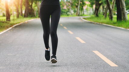 Wall Mural - Young woman runner running on city bridge road, Young fitness woman runner athlete running at road

