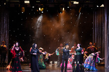 A Group Of Musicians, Singers And Dancers In Gypsy Costumes Perform On Stage.