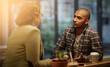 © Thurstan H/peopleimages.com - This is their favourite cafe. Cropped shot of a young couple sitting in a coffee shop.