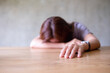 © Farknot Architect - A young woman get tired and asleep on the table