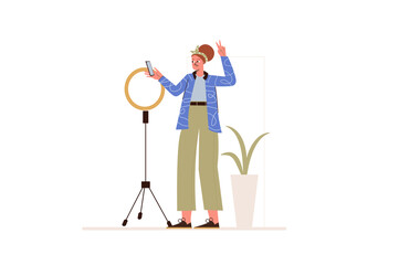 Poster - Live streaming concept in flat design. Young girl blogger broadcasting online to followers using ring light lamp and smartphone from home. Vector illustration with isolated people scene for web banner