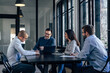 © bnenin - Joyful caucasian colleagues, attending a company meeting, in the conference room.