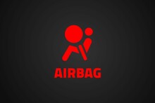 Red airbag icon and text on black background 