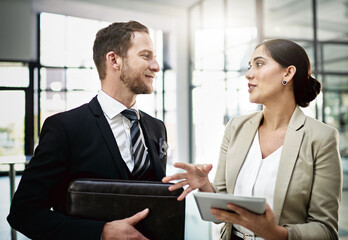 Aufkleber - his constructive criticism is always helpful. cropped shot of two businesspeople looking at a tablet