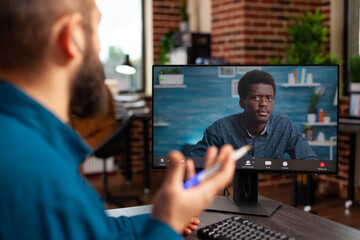 Poster - Businessman discussing marketing strategy with remote employee during online videocall meeting conference using computer. Manager working at company presentation in startup office. Teleconference call