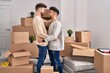 © Krakenimages.com - Young couple hugging each other standing at new home