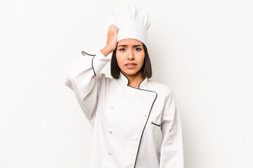 Young hispanic chef woman isolated on white background being shocked, she has remembered important meeting.