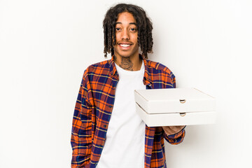 Young African American man holding pizzas isolated on blue background happy, smiling and cheerful.